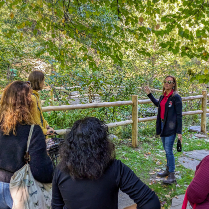 Lauren Errickson guides a tour in the Rain Garden.